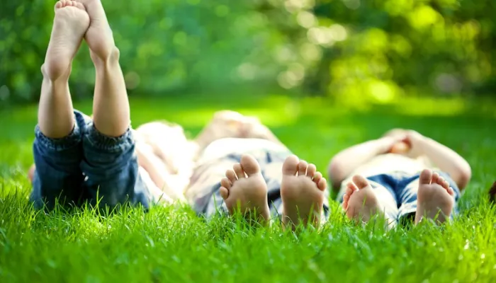 kids laying in the grass