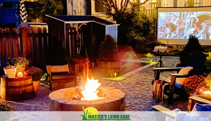 outdoor landscape with fire pit and movie screen
