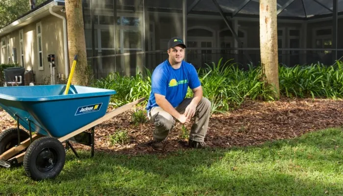 landscaping team member working in yard