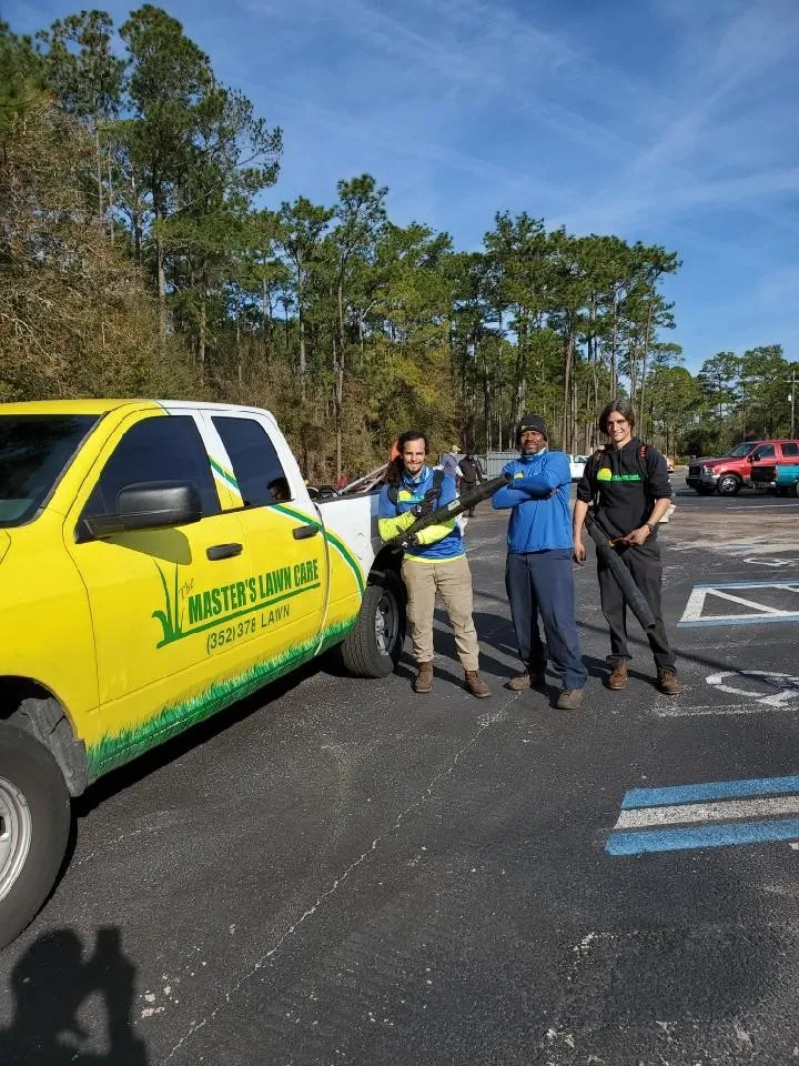 TMLC employees posing with equipment