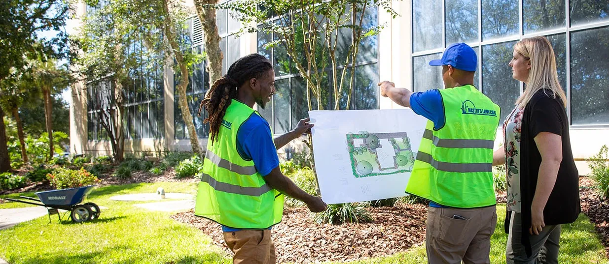 Ponte Vedra Landscape Design with employees pointing out plants