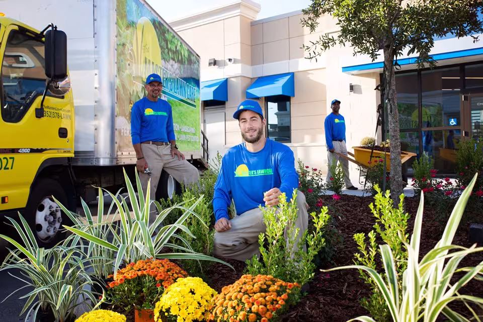 the masters team members in landscape posing