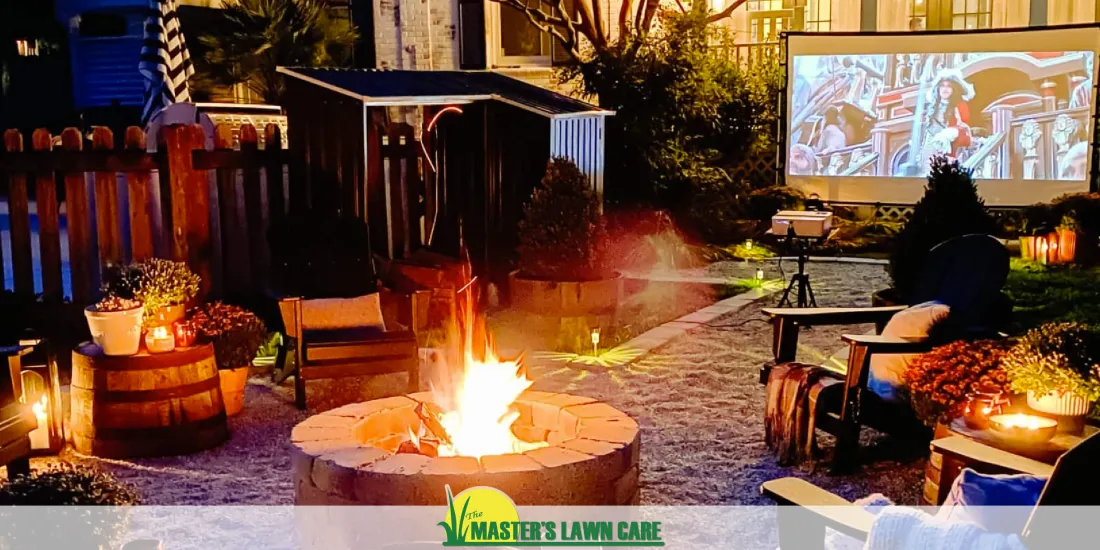 outdoor landscape with fire pit and movie screen