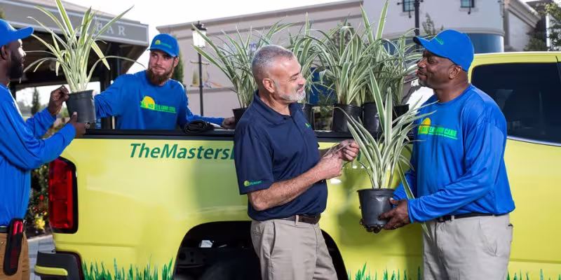 the masters lawn care technicians preparing to work on project