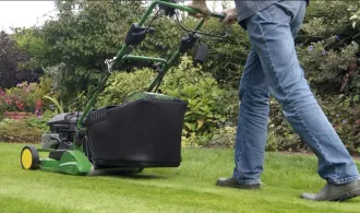 person mowing lawn