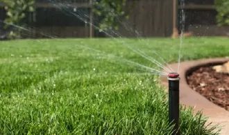 sprinkler head watering lawn