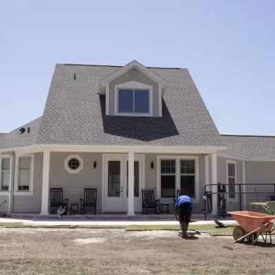 The Master’s Lawn & Pest crew installing sod around the newly completed outdoor living area.